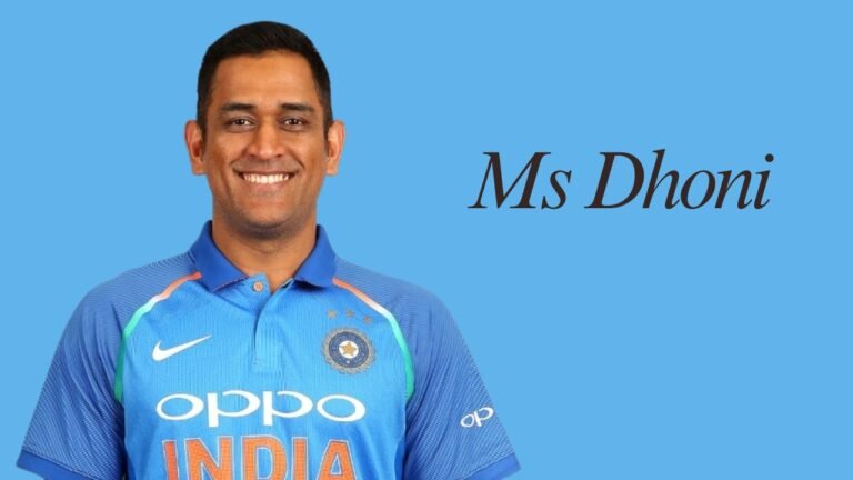MS Dhoni smiling in the India cricket team jersey during an official portrait.